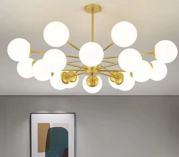 Lustre sputnik doré avec globes blancs — Watts Service Trading, matériel électrique Dakar Sénégal